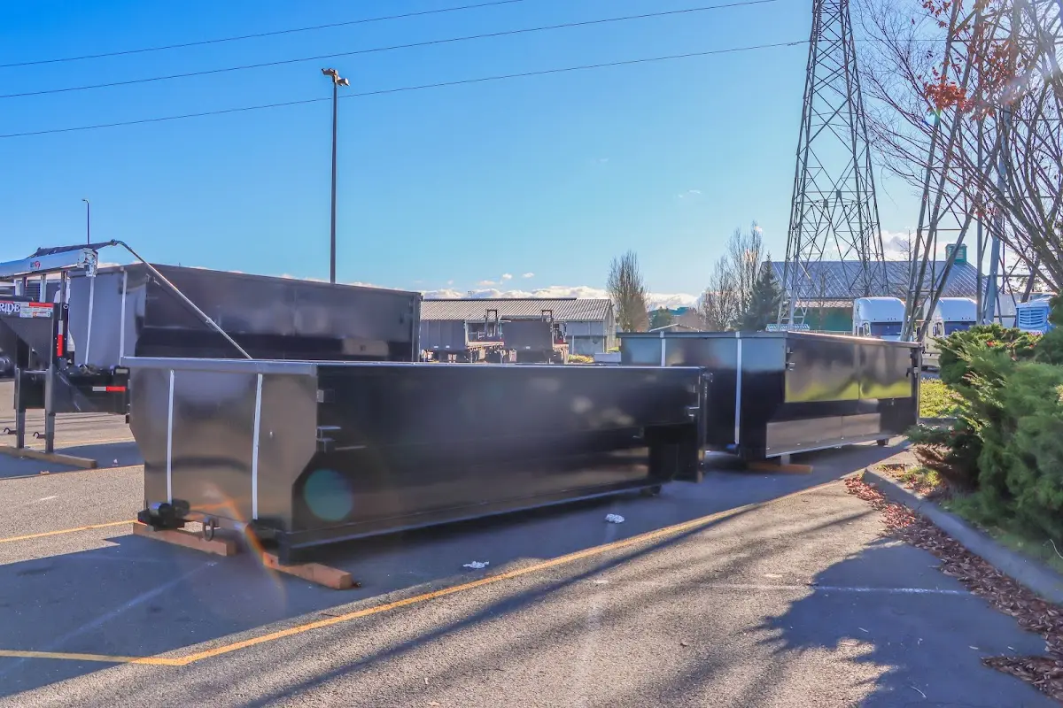 Roll-off dumpster ready for waste disposal at job site for Yard Waste Dumpster Rental in Hampton